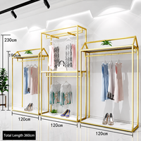 Portant à vêtements moderne en acier inoxydable doré, grande capacité, pour boutique, présentoir modulaire haut de gamme pour le commerce de détail