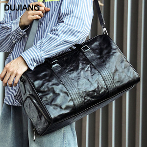 Sac de voyage en cuir véritable Dujiang 20-35L grande capacité, sac de sport pour homme, usage professionnel et loisirs - Product Image 1