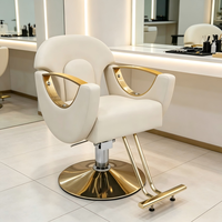 Chaise de coiffure hydraulique en PU blanc crème avec accoudoirs dorés pour salon de beauté