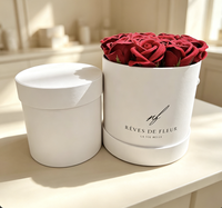 Rose éternelle blanche très vendue pour la Saint-Valentin dans un coffret cadeau rond en carton recyclé avec revêtement UV et logo personnalisé