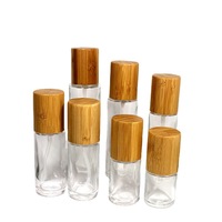 30 50 100 120 150 Ml Bening Buram Silinder Bahu Datar Pompa Losion Kaca Botol Minyak dengan Topi Bambu Botol Semprot Parfum