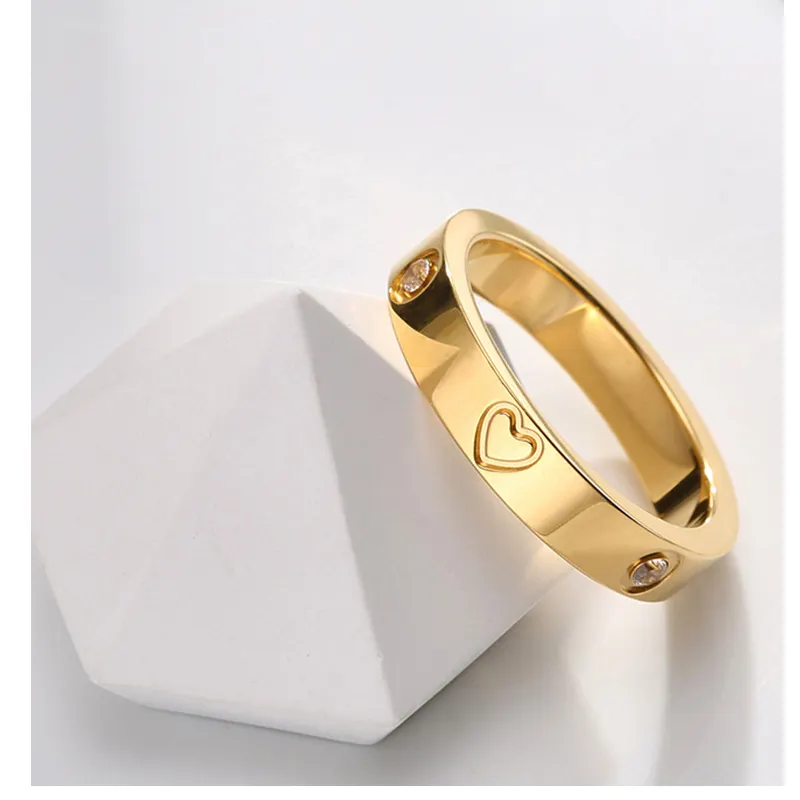 Haute qualité vente chaude hommes et femmes couples marque de luxe bijoux titane acier inoxydable diamant classique vis coeur anneau