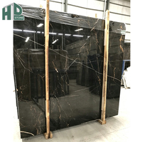 Dalles de marbre noir doré poli de luxe à prix d'usine pour revêtement mural intérieur, carrelage de sol et projets hôteliers