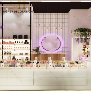 Moderno Exhibidor de Cosméticos Rosa y Blanco, Mueble de Tienda con Iluminación de Halo Morado para Tienda de Maquillaje - Product Image 1