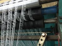 Machine à tricoter en fil de plumes pour la fabrication d'étoles de mode