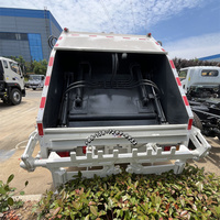 Chine haute qualité 8 mètres cubes 10 mètres cubes compression camion compacteur à ordures 8 tonnes 10 tonnes camion à ordures pour Isuzu