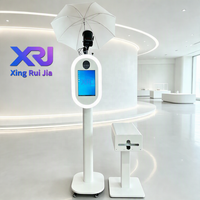 Xingruijia XRJ-cmp Photomaton ovale en métal à impression instantanée, écran tactile 14 pouces, appareil photo, impression en libre-service, ventilateurs de refroidissement RGB, détachable