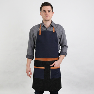 Delantal profesional de lona negra con detalles en cuero, correas ajustables, delantal de trabajo duradero para barberos, cafeterías y cocinas. - Product Image 1