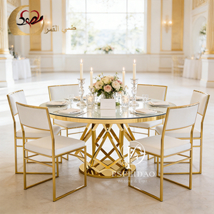 Mesa de Comedor Redonda Moderna con Tapa de Cristal y Base de Metal Dorado para Alquiler en Bodas y Hoteles - Product Image 1