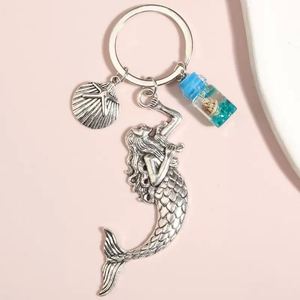 พวงกุญแจอะคริลิคใสลายปลาดาวในขวดลอยน้ำ - Product Image 6