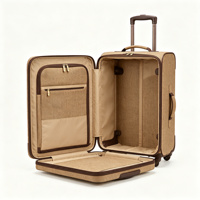 Valise à roulettes BONITA Softside avec serrure, en tissu beige, poche avant zippée, poignée télescopique et poignée latérale.