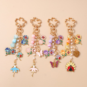 Nuevos modelos transfronterizos: Llaveros de cuentas, llaveros de mariposa, mariquita y flor, y dijes para bolsos, los más vendidos y clasificados. - Product Image 1