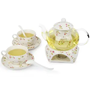 Venta caliente 24 oz té tetera de porcelana calentador 2 set de taza de la porcelana y platillo y cuchara tetera de cristal y más caliente