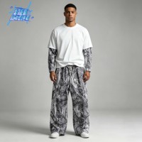 Ensemble de survêtement camouflage pour homme en molleton bouclette, style vintage automne, avec t-shirt à col rond motif écorce d'arbre superposé et pantalon de survêtement ample et droit, idéal pour la chasse