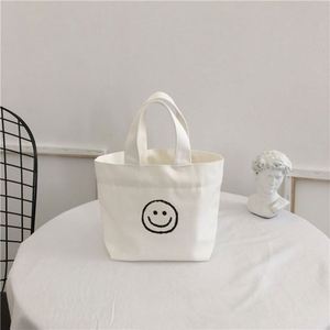 Nouveau sac fourre-tout en toile avec motif visage souriant, simple, polyvalent, artistique, jeune, sac à déjeuner pour femme, usage quotidien - Product Image 1