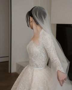 فستان زفاف الأميرة بقطار قابل للفصل من الدانتيل وبوليرو بأكمام كاملة مطرز بالخرز على شكل حرف A 567 - Product Image 2