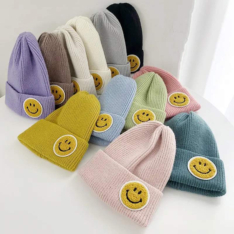 Hot sale women 15 colors stock wholesale knit beanies with logo smiley face beanie