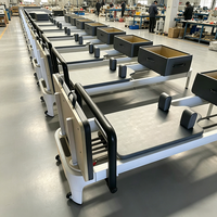 Lit de Pilates compact et pliable en aluminium blanc durable pour la remise en forme à domicile et en studio