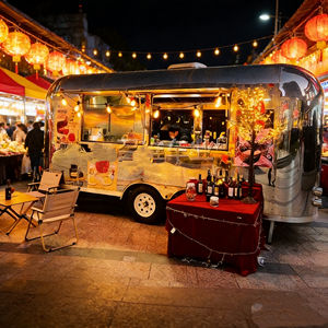 Chariot alimentaire mobile en acier inoxydable avec guirlandes lumineuses pour la vente de vin et de desserts, intérieur confortable - Product Image 1