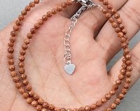 Collier ras du cou en pierre de grès dorée, micro-pavé de pierres précieuses, bijoux délicats et tendance pour soirée, style minimaliste