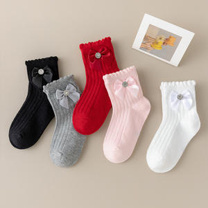 Chaussettes hautes en coton pour bébé fille avec nœud en diamant, respirantes et absorbant la transpiration, vente en gros pour l'automne et l'hiver - Product Image 1