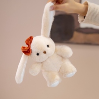 Peluche Lapin aux Oreilles Tombantes Moelleuse, Adorable Lapin Assis Blanc Beige avec Nœud en Velours Fleuri, Idéal pour Cadeau d'Anniversaire ou Décoration pour Enfants