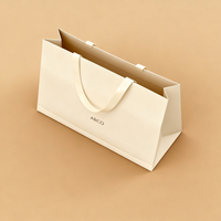 Sacs fourre-tout de grande capacité, sacs en papier recyclables respectueux de l'environnement avec logo de couleur personnalisé et personnalisé pour vêtements de centre commercial