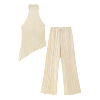 Ensemble tendance été 2026 pour femme : haut asymétrique uni à col halter et pantalon plissé décontracté à taille élastique