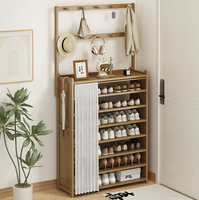 Meuble de rangement mural multi-niveaux avec porte-chaussures intégré, élégant support pour chapeaux et vêtements, et armoire à chaussures pour entrée