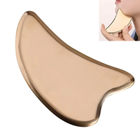 Outil de thérapie des tissus mous de masseur facial Gua Sha en cuivre avec panneau Guasha en métal et sac pour les produits de massage d'application du visage