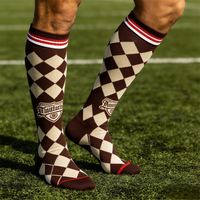 Chaussettes de football en nylon et élasthanne de qualité supérieure avec panneaux de ventilation en maille ciblée pour un refroidissement optimal pendant l'entraînement et les matchs estivaux