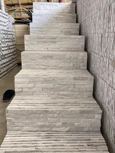 Venta al por mayor de ladrillo exterior de cuarcita blanca natural de la fábrica de piedra cultural de Chengdu con diseño de empalme de tiras