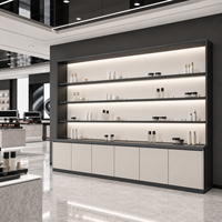 Vitrine de présentation cosmétique personnalisée, ensemble complet avec comptoirs îlots et armoires murales à LED pour magasin de beauté moderne noir et blanc
