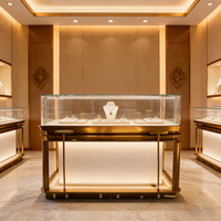 Vitrine de présentation moderne et minimaliste en verre, comptoir de luxe en acier inoxydable avec éclairage LED, pour bijoux, montres et diamants, idéale pour centre commercial ou kiosque.