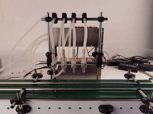 Máquina automática de llenado de líquidos de doble cabezal para perfumes y aceites esenciales, para botellas de aceite de motor y motocicletas Golden E Cross Motor, de gran venta - Product Image 5