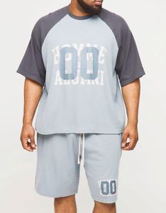 เสื้อยืดลายกราฟิกสีน้ำเงินเทาแบบโอเวอร์ไซส์ทรงบ็อกซี่ แขนเสื้อแบบแร็กแลน ผ้าวาฟเฟิล พร้อมกางเกงขาสั้น ชุดเซ็ต 2026 ขายส่ง ชุดวอร์ม - Product Image 1