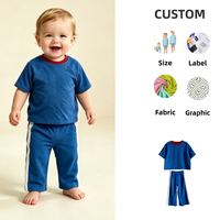 Ensemble 2 pièces pour enfants en tissu éponge de coton, haut à manches courtes avec blocs de couleur et pantalon droit à rayures latérales