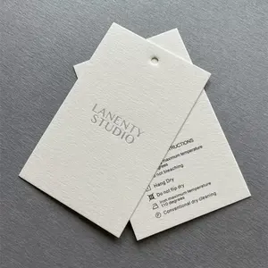 Customized 600g texture cotton paper logo silver foil hot stamping luxury labels thick paper hang tags for cloths