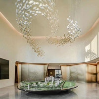 Lustre suspendu moderne personnalisé en verre en forme d'œuf pour plafond dans le hall d'un hôtel de luxe avec lumières décoratives de longue forme