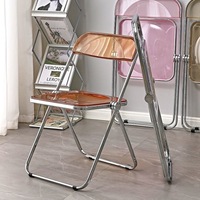 Chaise pliante à cadre métallique transparent, design moderne et épuré, chaise photo tendance pour magasins de vêtements et repas à domicile
