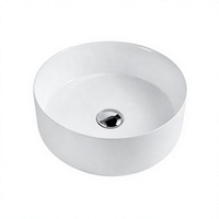 Lavabo en céramique rond à profil bas moderne de 120 mm de hauteur avec drain pour usage hôtelier, à poser sur comptoir ou à fixer au mur