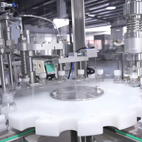 Machine de remplissage automatique compacte à double tête pour sirops, miels et liquides 30 ml