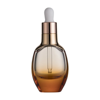Bouteille cylindrique de sérum de 30ml personnalisée avec compte-gouttes bouteille d'huile essentielle givrée bouteille en verre à épaulement plat emballage cosmétique