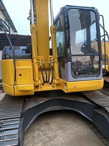 Excavatrice compacte sur chenilles Komatsu PC128US d'occasion, fonctionnement fluide pour les chantiers en espace restreint - Product Image 1