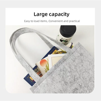 Produits en feutre de haute qualité avec logo personnalisé, un sac de shopping et de rangement en feutre gris écologique à grande capacité, à porter à l'épaule