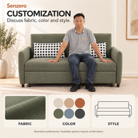 Sofa Tidur dengan Dua Bantal Sandaran Berbintik dan Platform Berlapis Kain Hijau yang Memanjang Melebihi Sandaran Tangan Samping