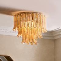 Plafonnier en verre Plume, hauteur réglable, longue suspension ronde en fer doré