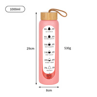Bouteille d'eau sport grande capacité écologique en verre borosilicate avec couvercle en bambou et manchon isolant en silicone, compatible lave-vaisselle et micro-ondes