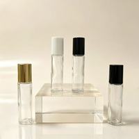Vente en gros de flacons en verre transparent de 10 ml avec bille interchangeable pour pompe pulvérisatrice, flacon vide pour parfum/huile essentielle, conteneur cosmétique personnalisé