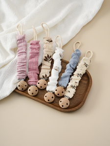 Attache-tétine portable en coton pour nouveau-né avec motif imprimé, support de tétine, hochet et chaîne de dentition en silicone pour bébé - Product Image 1